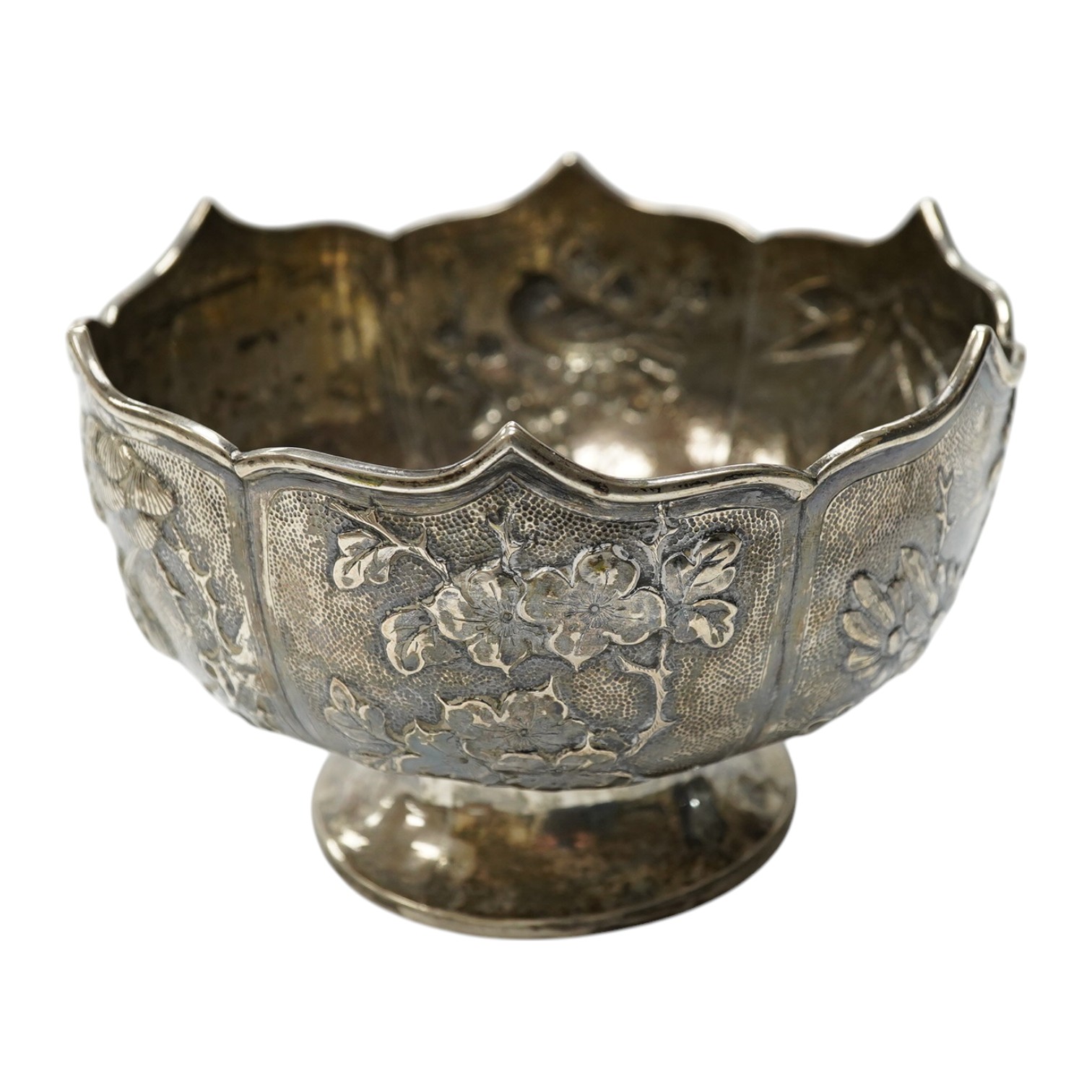 A late 19th/early 20th century Chinese white metal pedestal bowl, decorated with birds and foliage, diameter 15.2cm, 9.5oz. Condition - fair to good.